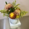 Bask in the warmth of golden hues with the Sunset Glow arrangement