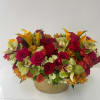 Designer arrangement of roses, mini cala lilies, orchids and spray roses in