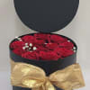 Very Elegant Black round box with a lid field with 12-14 red