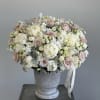 Embrace the simplicity and sophistication of stone vase arrangement in soft white