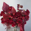 Elevate your space with this breathtaking all-red arrangement, artfully designed in a