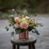 Here luxurious roses in a peachy terracotta tone accompany muted ivory and