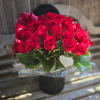 3 dozen red roses artfully arranged in a black velvet box. This