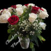 Red/white roses in a vase with filler