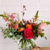 This arrangement is uniquely crafted with the love of all things bright