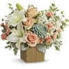 Reminiscent of a desert sunrise, this modern mix of peach blooms, white