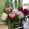 Great quality artificial peonies in a nice rectangular clear vase with water