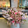 The &quot;Pastel Roses Delight Vase&quot; is a lovely arrangement featuring a blend