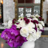 The &quot;Majestic Orchid Violet Vase&quot; is a striking arrangement that combines the