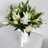 The &quot;Pure White Lilies Elegance Vase&quot; arrangement is a stunning display of