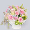 A short and sweet arrangement of pink roses and pink ranunculus. The