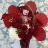 2 Dozen beautifully designed in a nice red vase with red dried