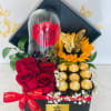 Wooden box with red roses, sunflower, Eternal rose and chocolates.