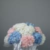 A basket filled with lush, fluffy hydrangeas, offering a soft and elegant