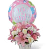 Mixed pinks and white arranged in a white basket ith a &quot;It&#039;s
