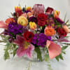 Colorful bouquet filled with Protea, Stock, seeded eucalyptus, snap dragon, African roses