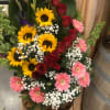 This basket is perfect for many occasions. Comes with Roses sunflowers and