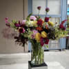 Perfect arrangement for the foyer of your home featuring garden roses, allium