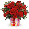 Resplendent red roses in an artistic mosaic glass keepsake vase make a