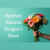 Handheld bouquet of mixed colorful flowers