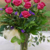Our One Dozen Hot Pink Roses with Statice is a bright and