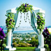 The wedding arch or bamboo canopy creates the focal point of the