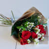 Beautiful Roses wrapped with beautiful filler and greenery 