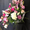 AN ASSORTMENT OF SEASONAL BLOOM IN A SMALL SUITCASE