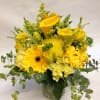 Gives someone a burst of brightness! This powerful yellow arrangement features yellow