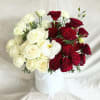 White flower box filler with white and red roses with accent of