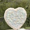 Captivate the heart with the White Standing Heart Arrangement, a timeless expression