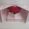 Pull open box filled with 18 roses and a drawer filled with