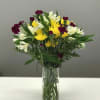 Simple and bright this arrangement is poised and price to remind a