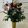 1 dozen roses with baby breathe in a gold vase, eucalyptus ruscus