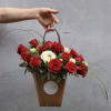 A kraft bag with red roses is a classic and timeless way