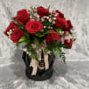 Small box wit 2 doz red roses and filler flowers. (Diamond pins