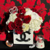 Experience the epitome of sophistication with this exquisite floral arrangement presented in