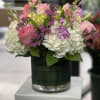 Classic and Beautiful, this large arrangement whispers luxury. Soft pinks, whites and