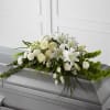 A smaller but elegant casket spray that truly encompasses the warmth they