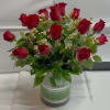 18 red Ecuadorian roses in a circular vase. 