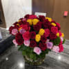 This is a beautiful arrangement in a clear glass vase with a
