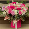 A beautiful custom flower arrangement. Pink and light red colors put together