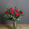 Not your everyday dozen roses. Unique accents and bespoke designs 

This arrangement