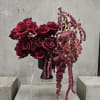 Elevate any space with Love&rsquo;s Embrace&mdash;a striking floral arrangement featuring deep red