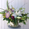 Large and lush combination whites and purple with of fragrant lilies, mums