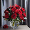Two Dozen cute short stemmed red roses either in a vase or