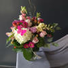 This delicate arrangement of whites, pinks, and lavenders is sure to please!