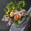Delphinium, Stock and more combine for an eclectic arrangement that carries a