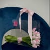 20 tulips of any color arranged in a purse