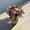 This is a perfect arrangement with the perfect variety of flowers! Includes
